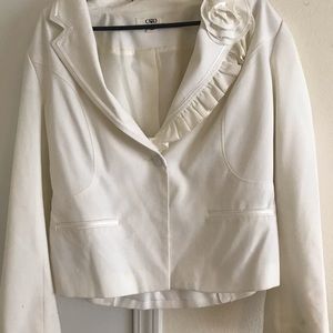 White suit jacket w/ flower brooch